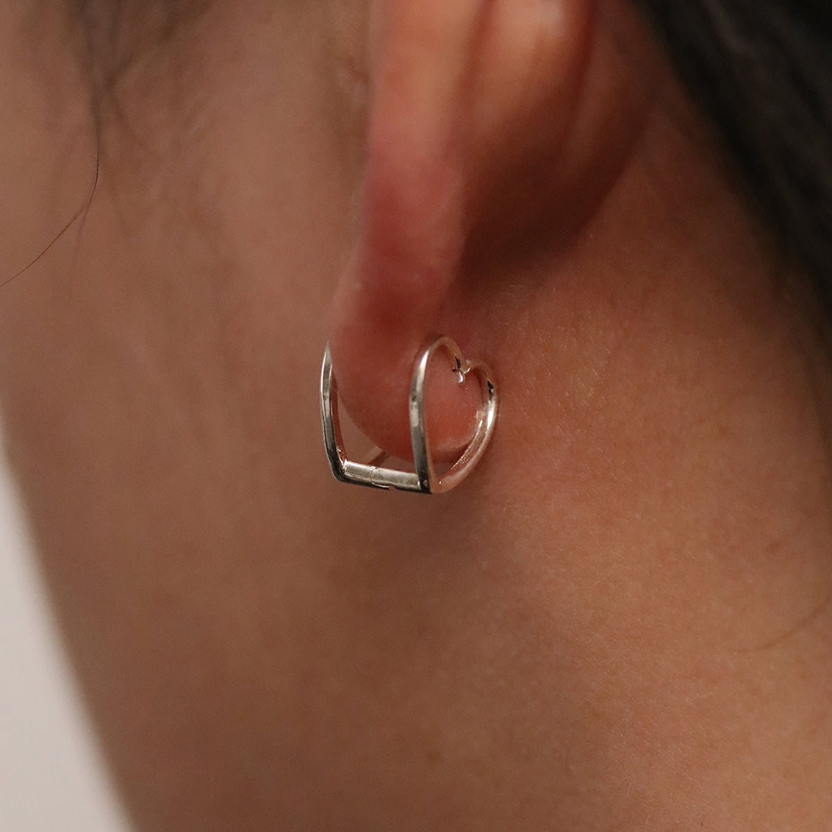 Heart silhouette huggie earrings-4